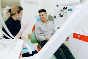 Man Sitting in Dental Chair - dentist asheville